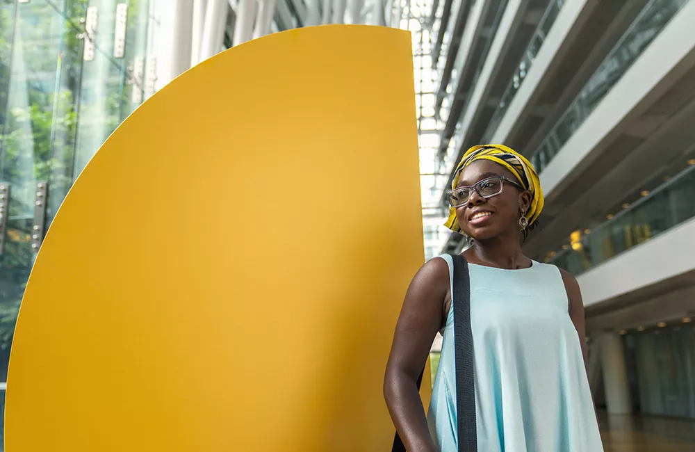 Young professional with an engaging look on her face, ready to take on a challenge.